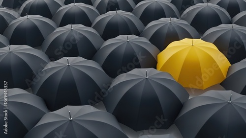 Unique yellow umbrella stands out among black ones