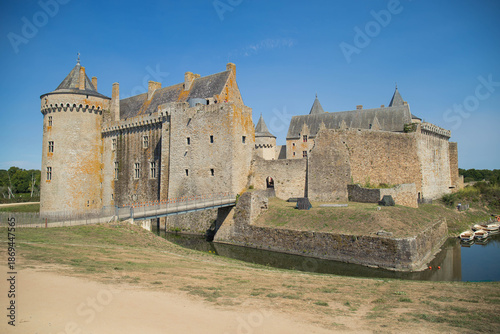 Entire view of Suscinio Castle surrounded by its moat on a sunny day. Background with copy space, no people. Sarzeau, Brittany, France.