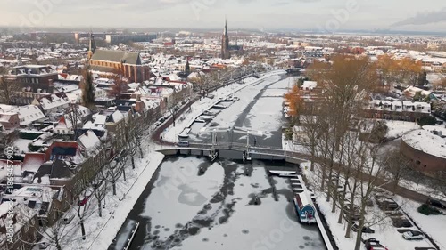 Aerial winter view of Weesp and river Vecht covered in snow, North Holland, Netherlands