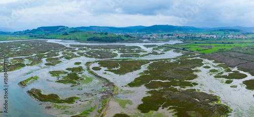 Εκτύπωση καμβά Aerial drone view of the landscape surrounding the Cerroja Mill in Escalante, within the Santoña, Victoria and Joyel Marshes Natural Park