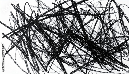 Chaotic black crayon scribbles forming an abstract background with expressive hand-drawn strokes