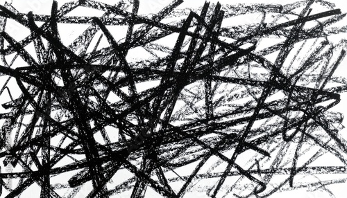Chaotic black crayon scribbles forming an abstract background with expressive hand-drawn strokes and vibrant energy