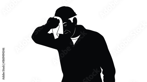 Construction worker in hard hat wiping sweat from forehead after hard labor under the sun