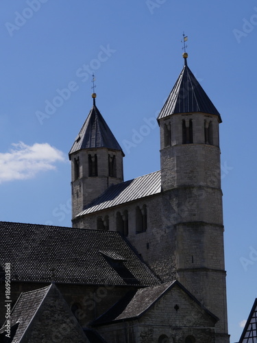 Towers of the west work, seen from the northeast, of the Lutheran collegiate church of Bad Gandersheim Germany. Construction began in year 881. Some Carolingian walls have been preserved