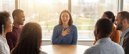 Woman speaking with hand on chest in group session, emotional honesty, empathy and self awareness practice
