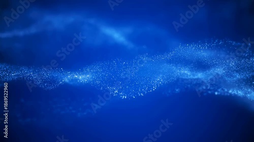 Abstract blue wave of sparkling particles flowing gracefully. Represents digital innovation, technology, and creativity in motion