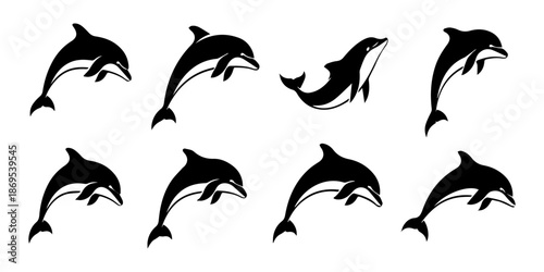 Elegant black silhouettes of leaping dolphins showcase marine life and graceful movement