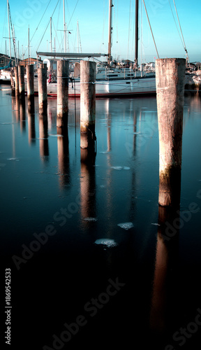 Photos Piles in a frozen harbor basin in the marina in Aalborg
