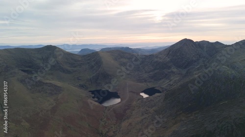 Spectacular 4K aerial video of flying above highest mountain ridge in Ireland - McGillyCuddy Reeks at sunset, with breathtaking views around, Kerry mountains, Ireland