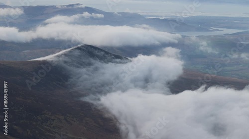 Spectacular 4K aerial video of flying above highest mountain ridge in Ireland - McGillyCuddy Reeks at sunset, with breathtaking views around, Kerry mountains, Ireland