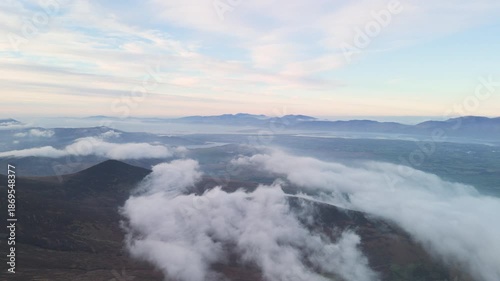 Spectacular 4K aerial video of flying above highest mountain ridge in Ireland - McGillyCuddy Reeks at sunset, with breathtaking views around, Kerry mountains, Ireland