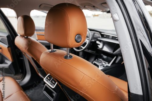 Wallpaper Mural Premium, modern brown interior of an electric car, leather steering wheel, large navigation screen, air ducts, deflectors on the car panel. Interior details. Torontodigital.ca