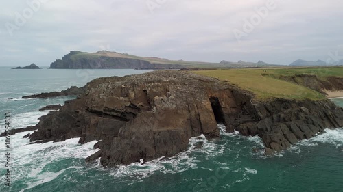 Scenic 4K aerial video of flying above spectacular Atlantic coastline, with picturesque rocks, cliffs and islands, Sybil head, Dingle Peninsula, Kerry, Ireland