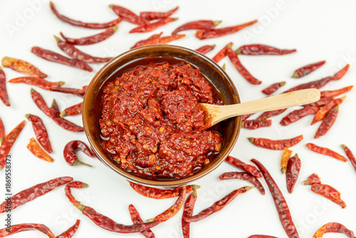 Dried chili peppers and broad bean paste served in a porcelain bowl