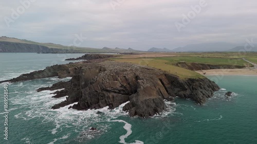 Scenic 4K aerial video of flying above spectacular Atlantic coastline, with picturesque rocks, cliffs and islands, Sybil head, Dingle Peninsula, Kerry, Ireland