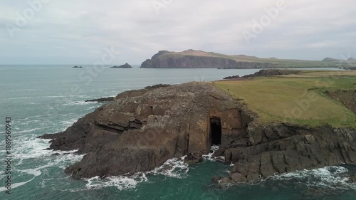 Scenic 4K aerial video of flying above spectacular Atlantic coastline, with picturesque rocks, cliffs and islands, Sybil head, Dingle Peninsula, Kerry, Ireland