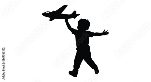 A child joyfully playing with a toy airplane captured in silhouette