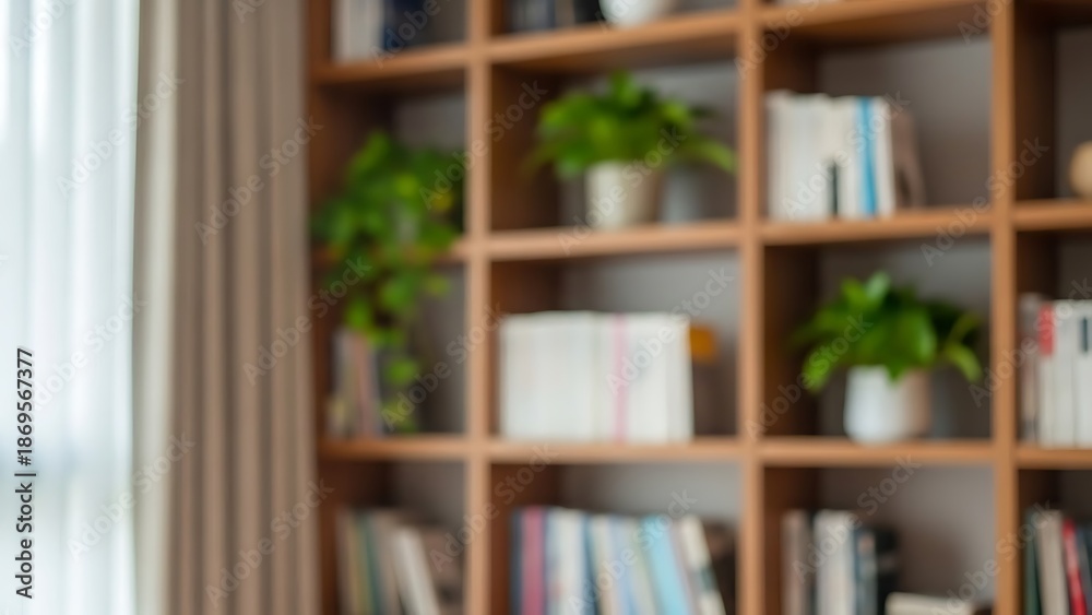 Fototapeta premium A blurred view of a cozy home library with books and potted plants on wooden shelves