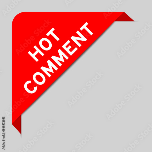Red color of corner label banner with word hot comment on gray background