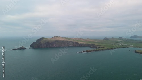 Scenic 4K aerial video of flying above spectacular Atlantic coastline, with picturesque rocks, cliffs and islands, Sybil head, Dingle Peninsula, Kerry, Ireland