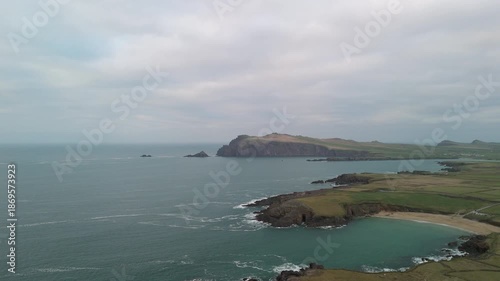 Scenic 4K aerial video of flying above spectacular Atlantic coastline, with picturesque rocks, cliffs and islands, Sybil head, Dingle Peninsula, Kerry, Ireland