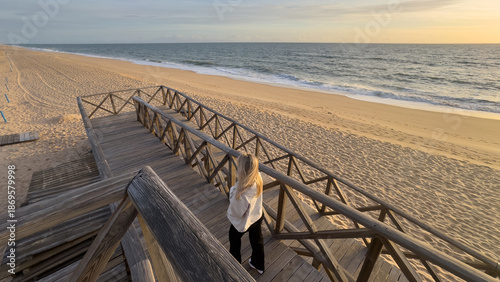 Obraz w ramie Wooden walkway on a beach at sunset