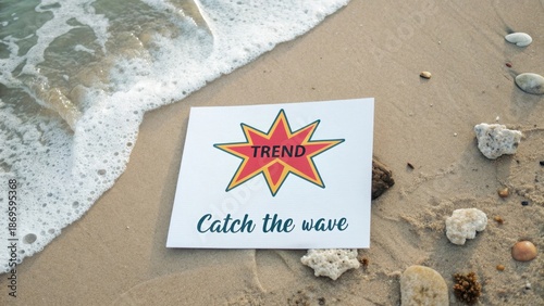 White card on sandy beach with the trend word