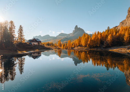 Obraz na płótnie Scenic autumn view of Lago di Federa with Croda da Lago peak and cabin reflectio