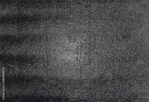 фотографія Dark black grunge bumpy textured surface background