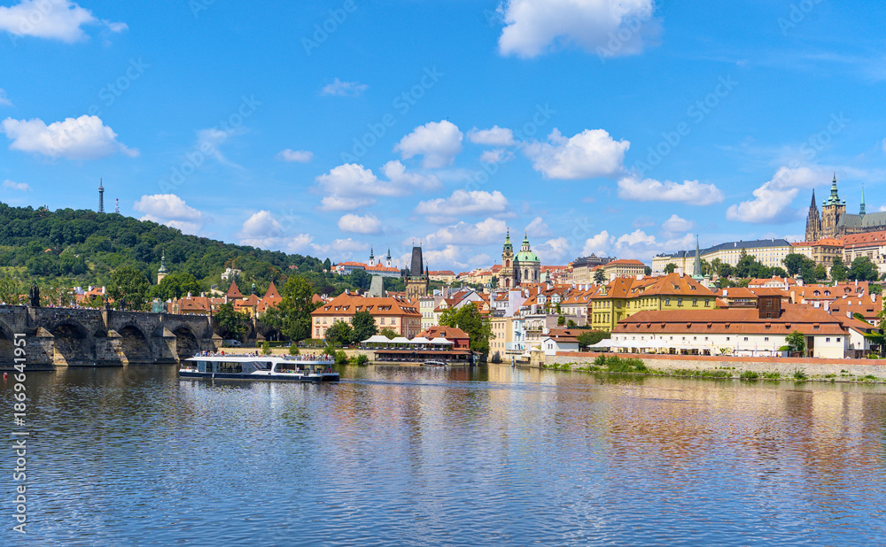 Fototapeta premium Panoramic view of Petrin Hill, Charles Bridge and Prague Castle in Prague, Czech Republic