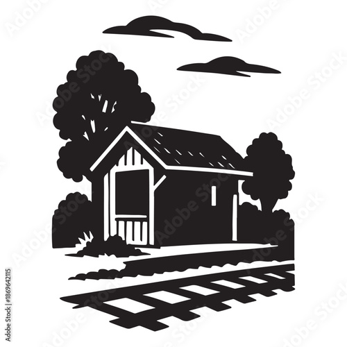 Black and white illustration of a small train station building with railroad tracks and trees in the background