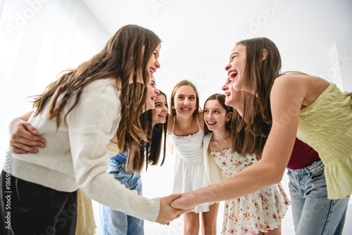 Group Of Teenage Girlfriends on studio white background