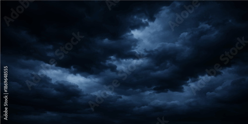 Dramatic dark storm clouds time lapse across a summer sky with sunlight breaking through the blue atmosphere for a powerful nature weather cloudscape