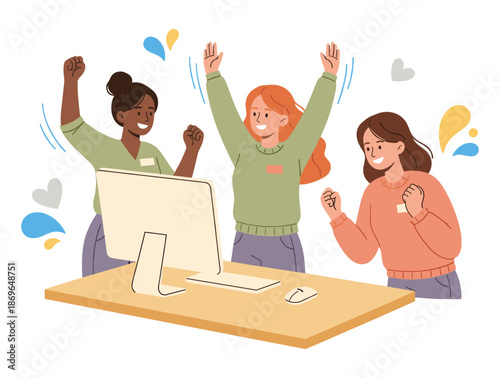 Women celebrating achievement at a computer desk