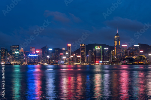 Evening view of Hong Kong from Kowloon. Kowloon's waterfront, boats, skyscrapers, lights, ferries. Hong Kong, China. 23 May 2025