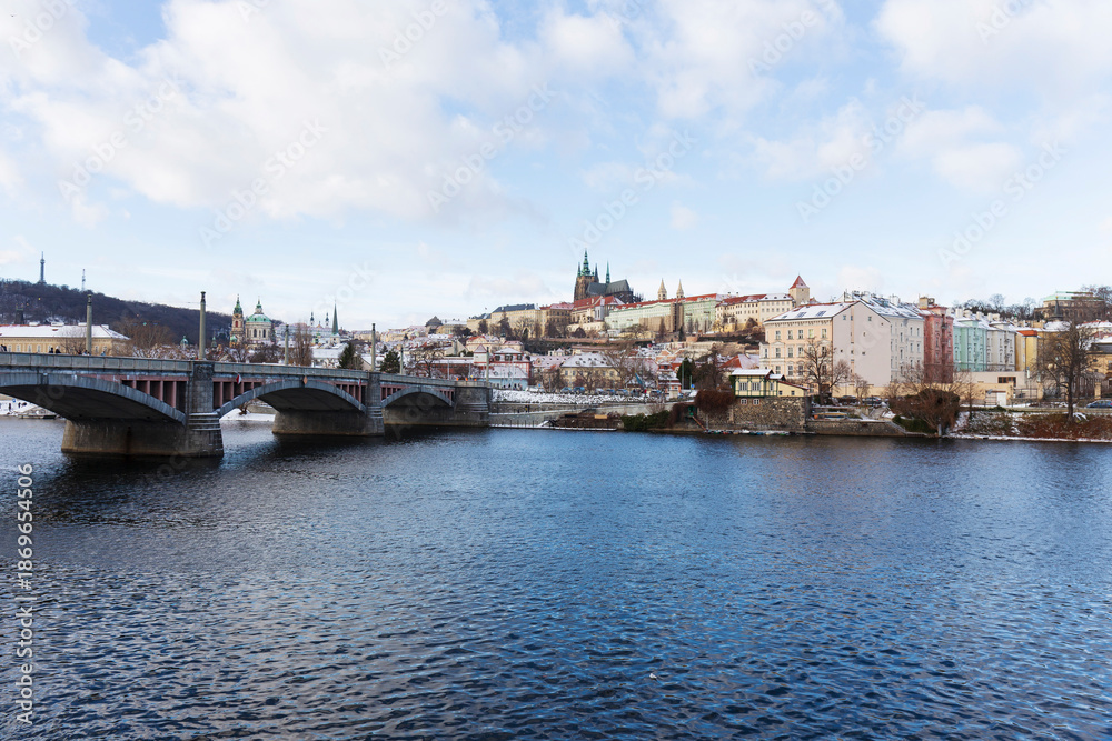 Fototapeta premium Snowy Prague Lesser Town with gothic Castle, Czech Republic 