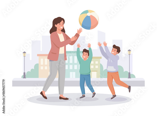 Family playing with beach ball in urban park