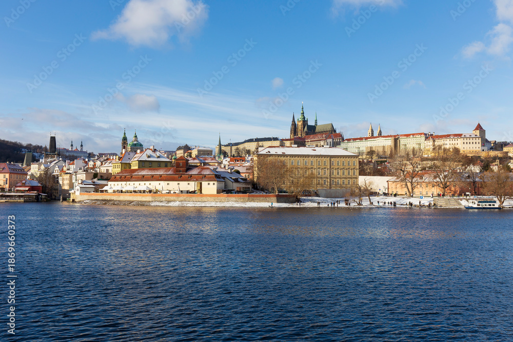 Obraz premium Snowy Prague Lesser Town with gothic Castle, Czech Republic 
