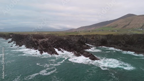 Scenic 4K aerial video of flying above spectacular Atlantic coastline, with picturesque rocks, cliffs and islands, Sybil head, Dingle Peninsula, Kerry, Ireland