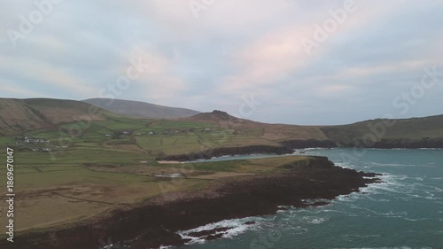 Scenic 4K aerial video of flying above spectacular Atlantic coastline, with picturesque rocks, cliffs and islands, Sybil head, Dingle Peninsula, Kerry, Ireland