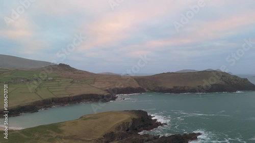 Scenic 4K aerial video of flying above spectacular Atlantic coastline, with picturesque rocks, cliffs and islands, Sybil head, Dingle Peninsula, Kerry, Ireland