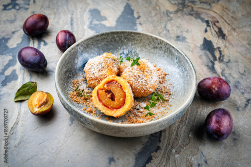 Картината върху платно Traditional Austrian zwetschgenknödel - plum  dumpling stuffed with prune in a d