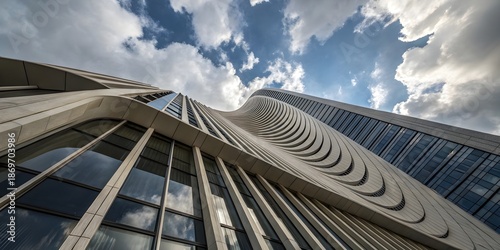 Dramatic upward view of modern skyscraper architecture representing innovation, corporate growth, and urban development