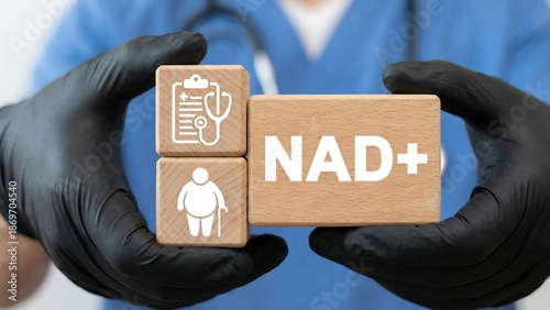 NAD+ intravenous or syringe injection of vitamins, supplements, minerals medical therapy concept. Doctor holding wooden blocks with icons sees the text NAD concept