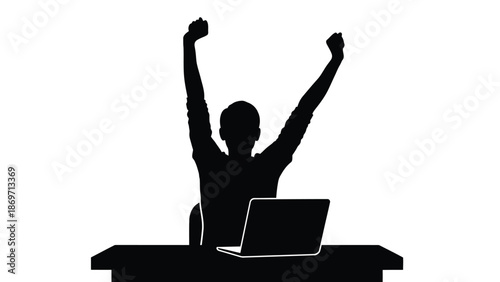 Silhouette of a motivated person sitting triumphantly at a desk with a laptop open and both arms raised in a celebratory gesture of success and achievement