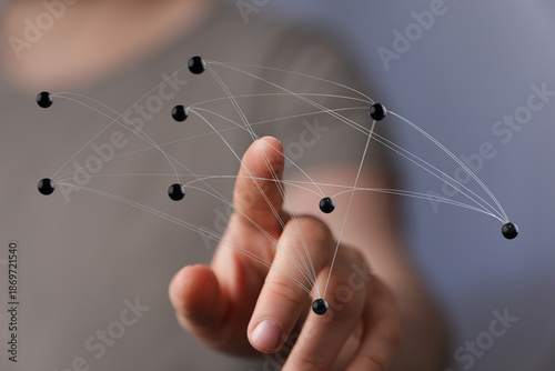 Photography Hand touching digital network nodes