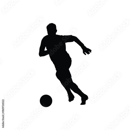 Silhouette of a Soccer Player Dribbling the Ball