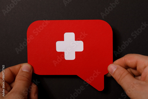 A person is holding a red s...