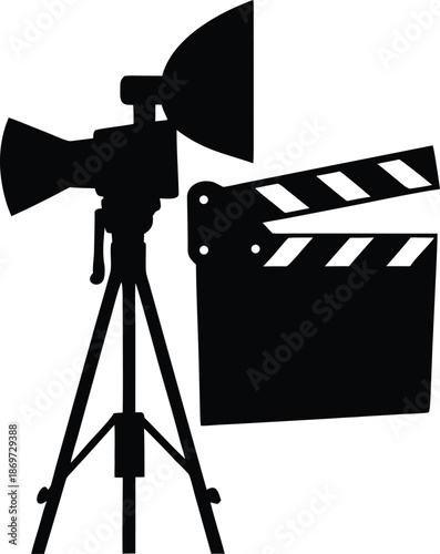 Professional film production equipment with a clapboard and studio light on tripod