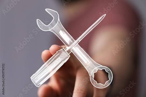 Image depicts a hand holdin...